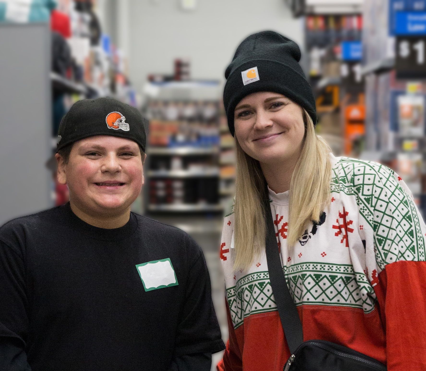 A man and a woman are posing for a picture in a store.