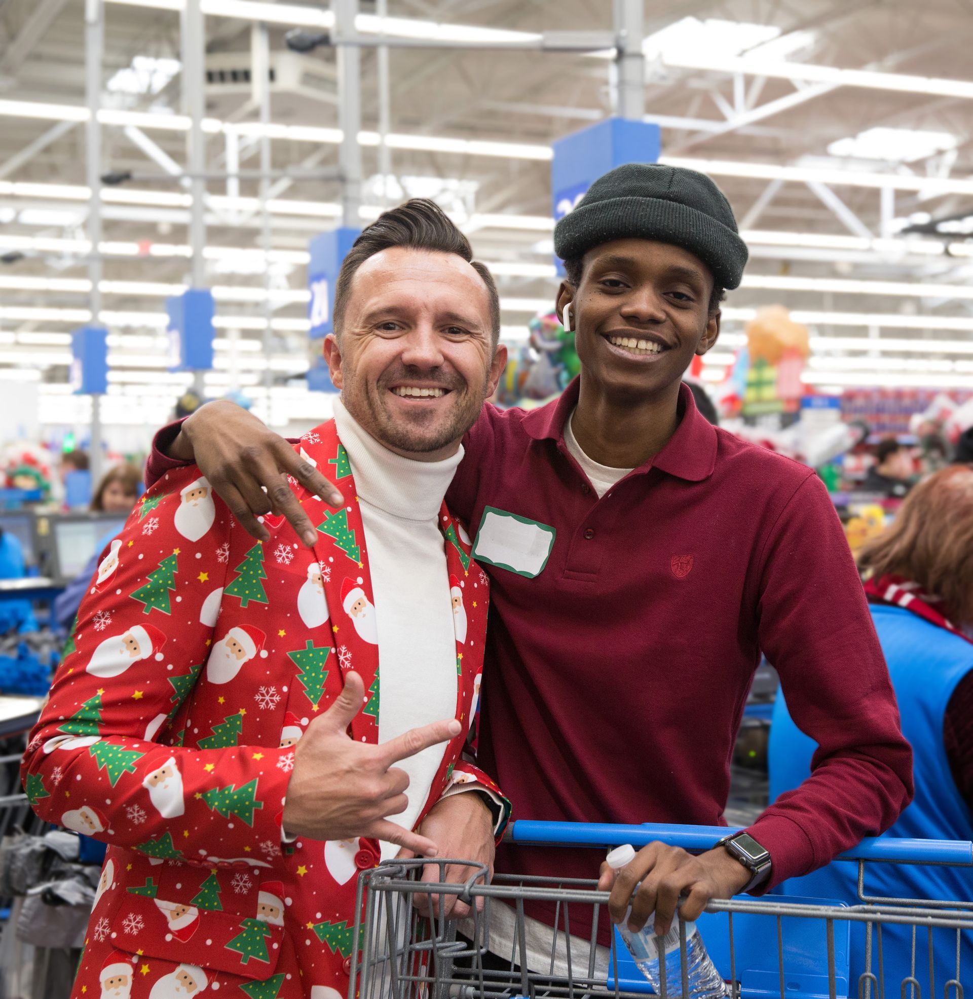 Two men are posing for a picture in a store