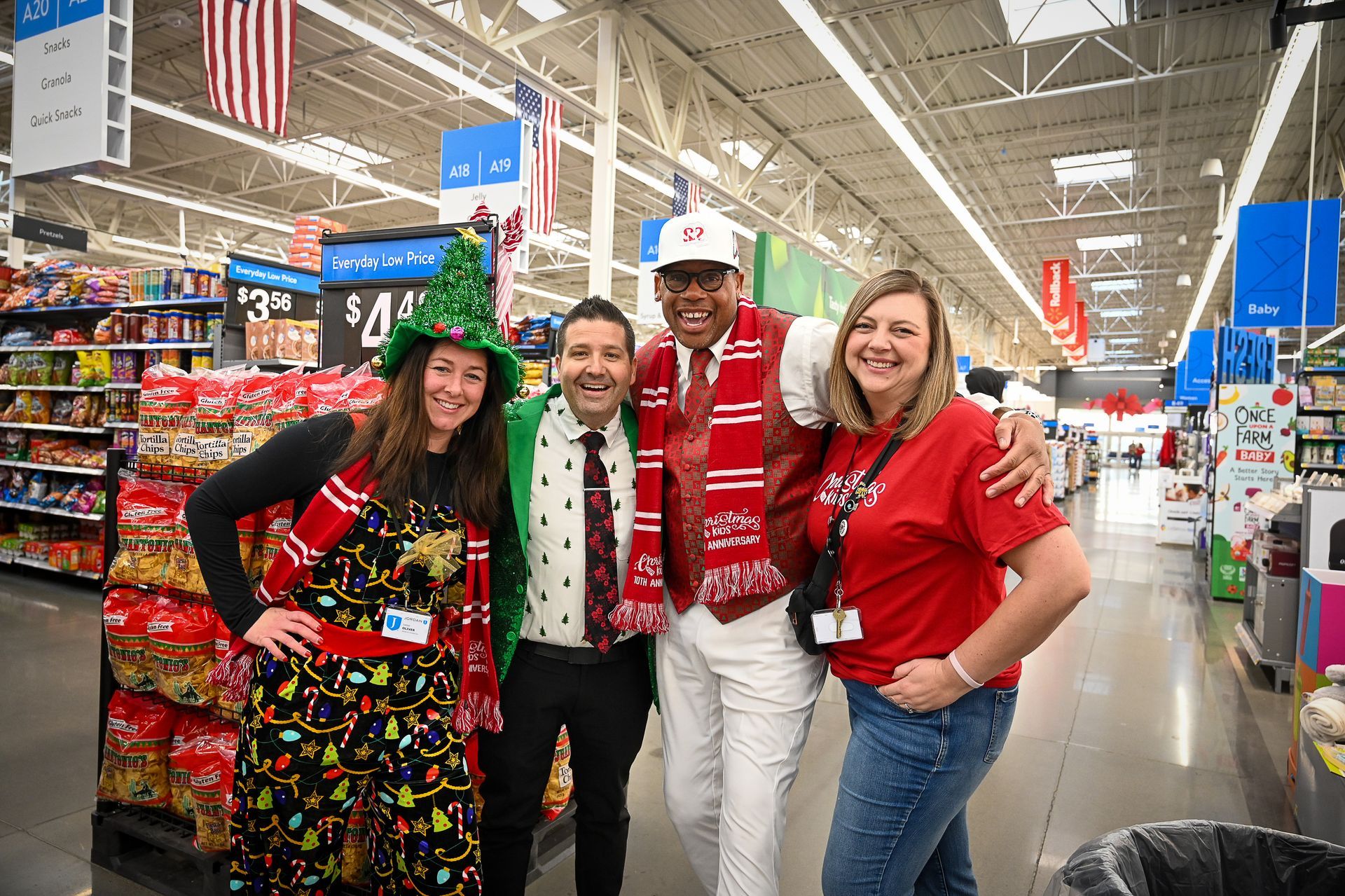 A group of people are posing for a picture in a grocery store.
