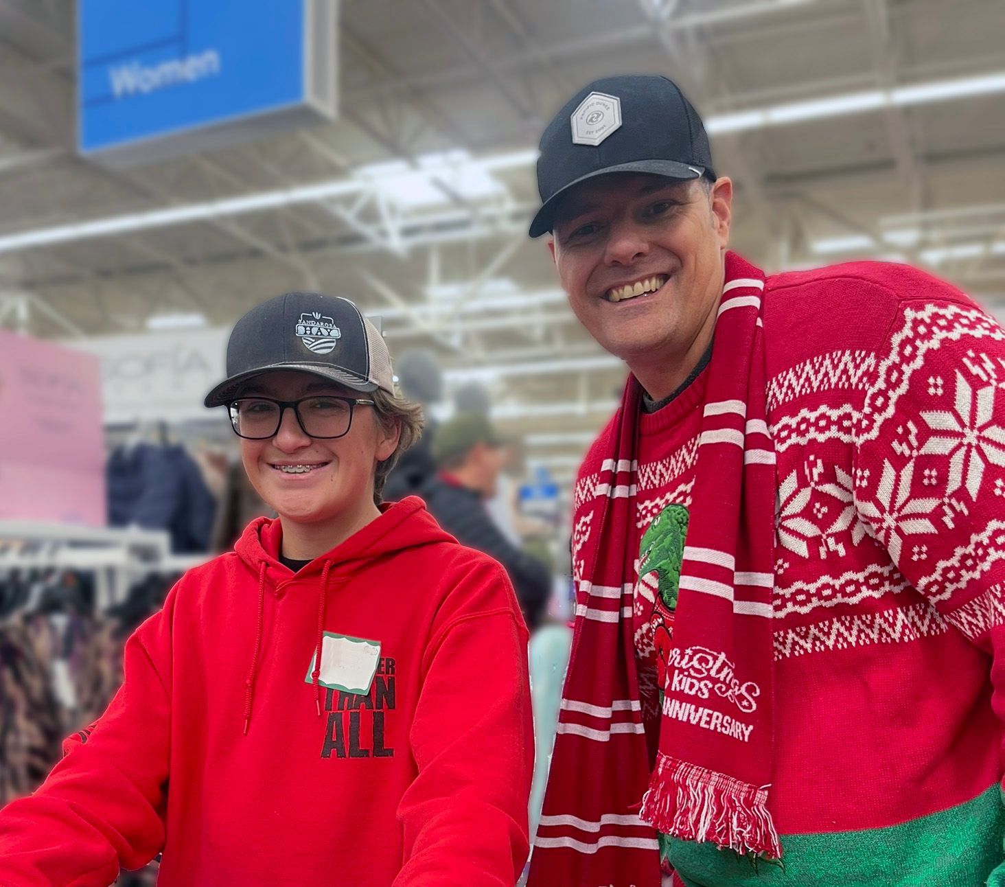 A man and a woman are posing for a picture in a store.