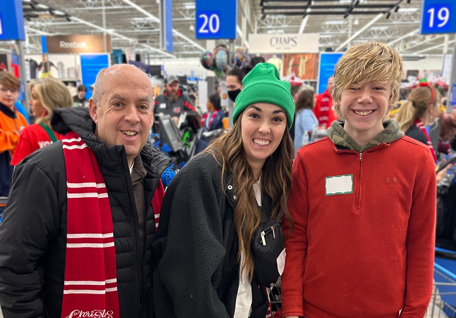 A group of people are posing for a picture in a store.
