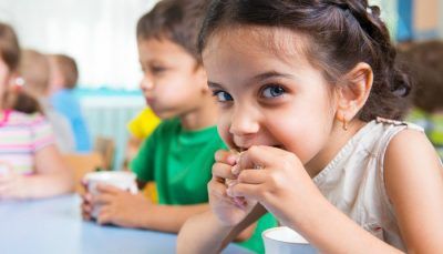 A Child enjoying a Snack