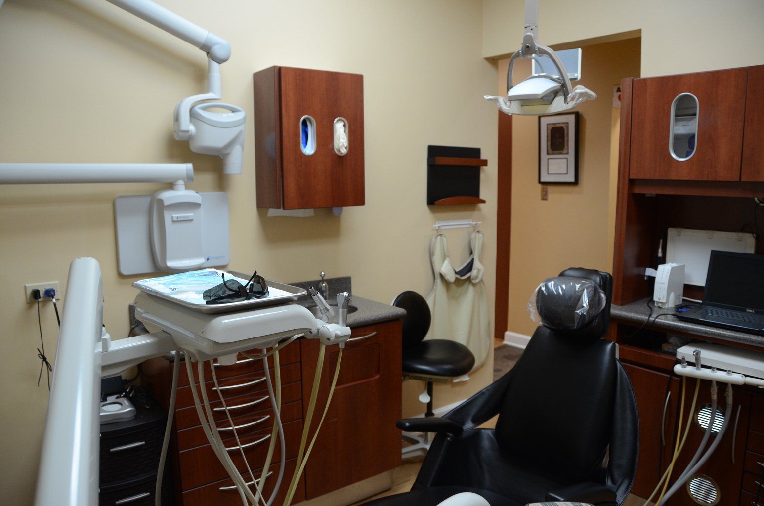 A dental office with a dental chair and dental equipment