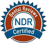The logo for dental reviews ndr certified is red , white and blue.
