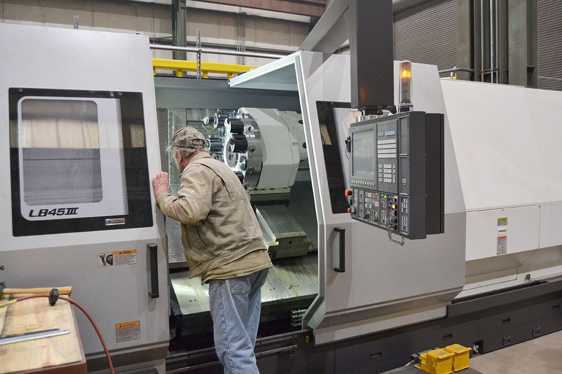 Man Checking The Machine — Tuscaloosa, AL — Brion Hardin