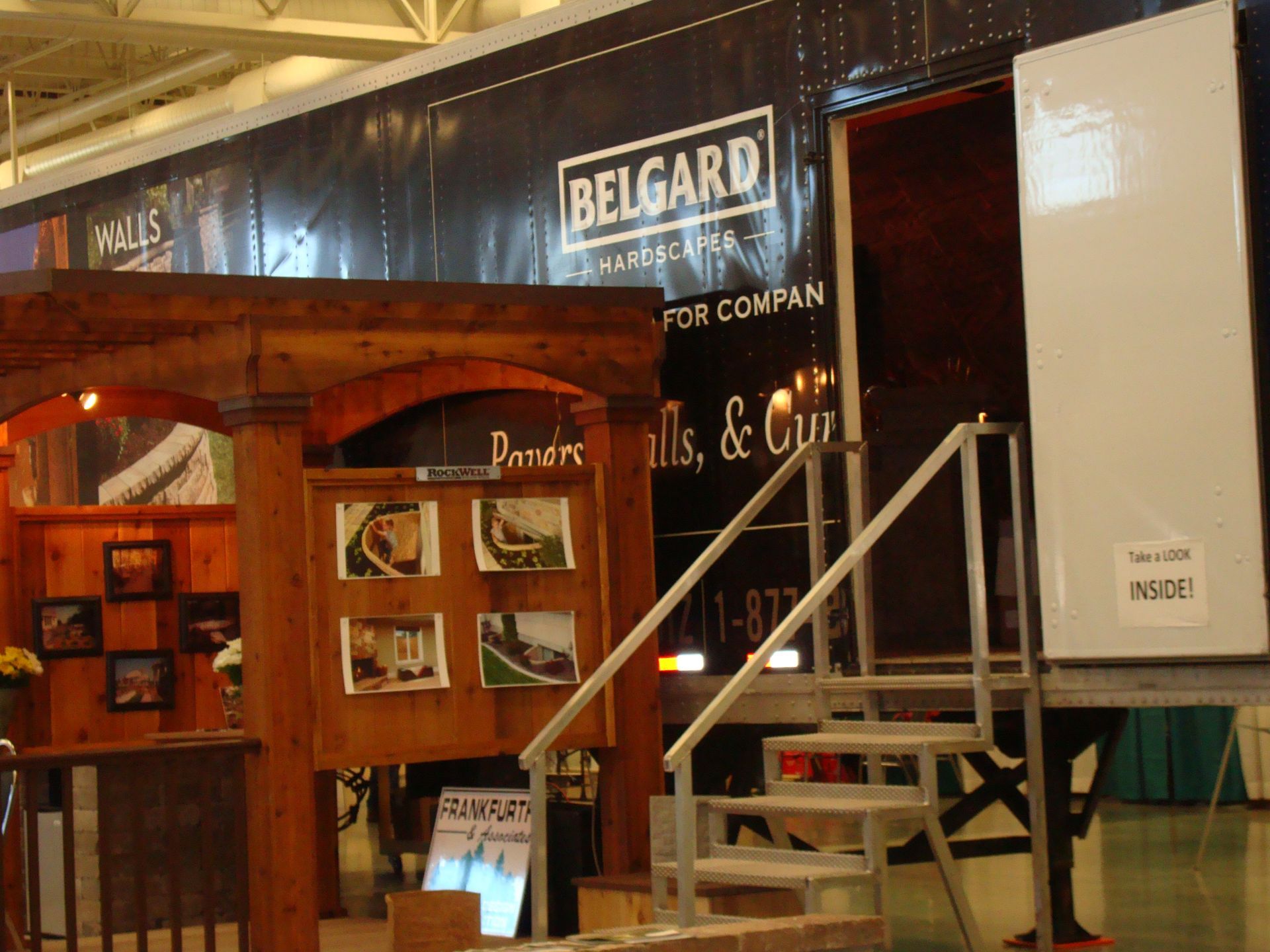 A building with stairs and a sign that says belgard