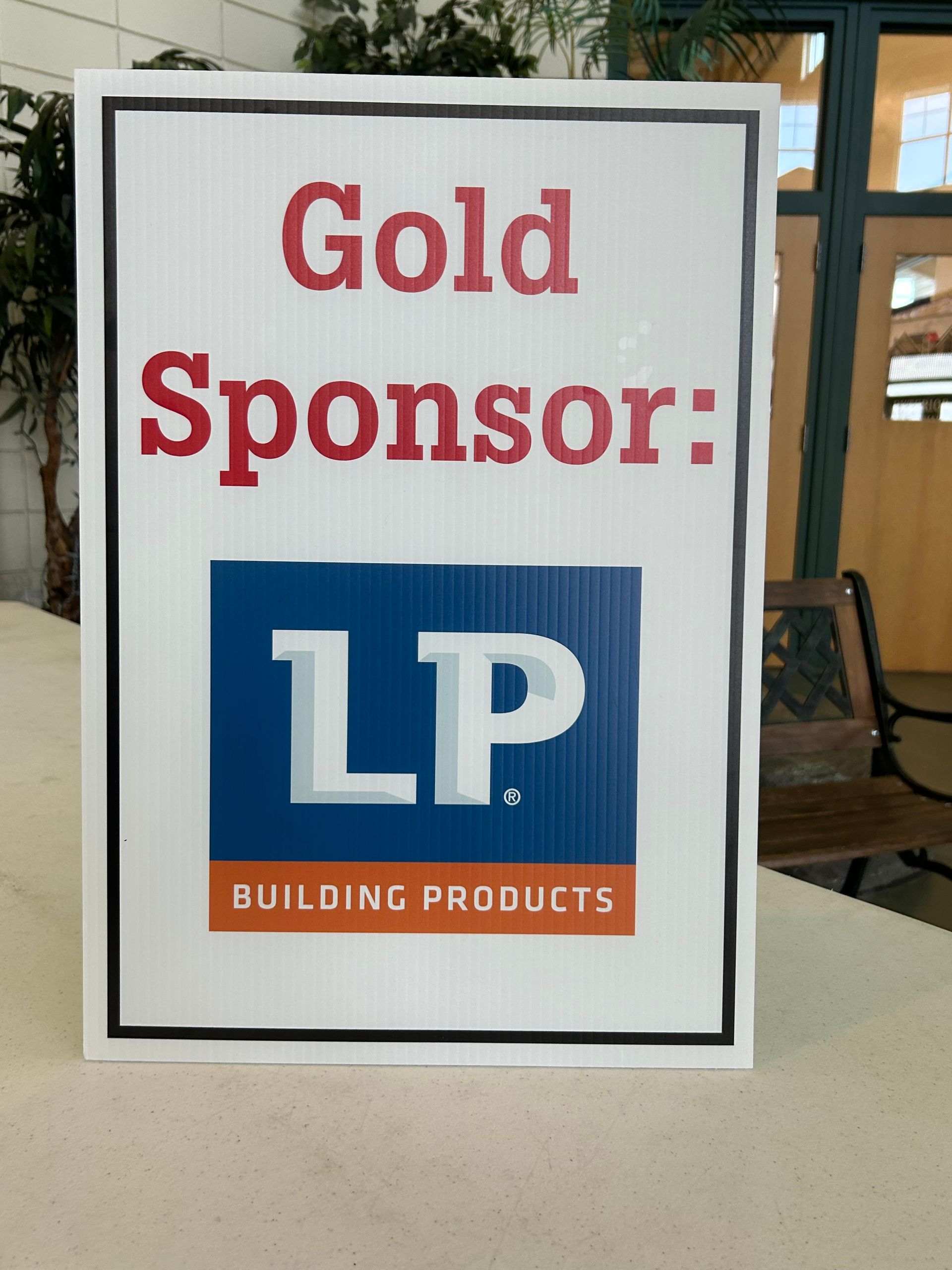 A sign that says gold sponsor lp on it