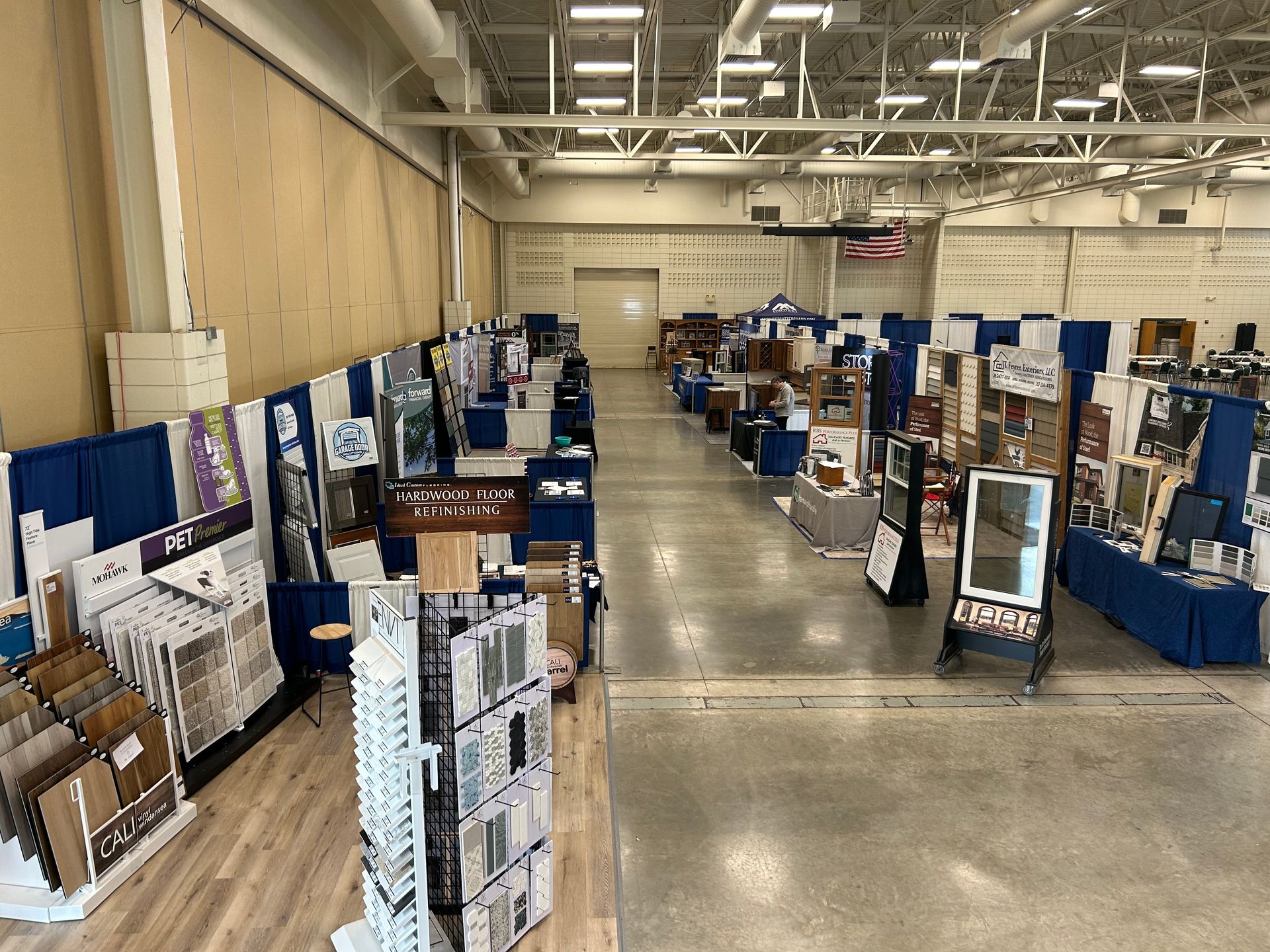 A large warehouse filled with lots of displays and tables.