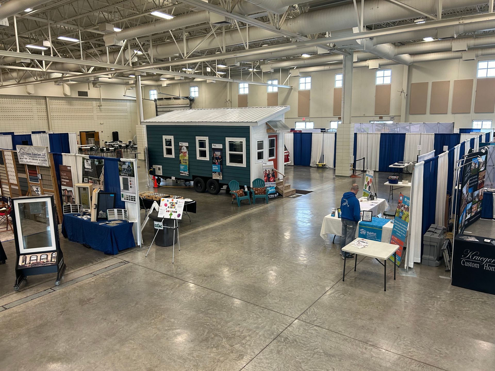 An aerial view of a large room filled with tables and chairs.