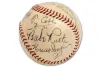 Baseball signed by Ty Cobb, Babe Ruth, and others. Brown stitching on white leather.