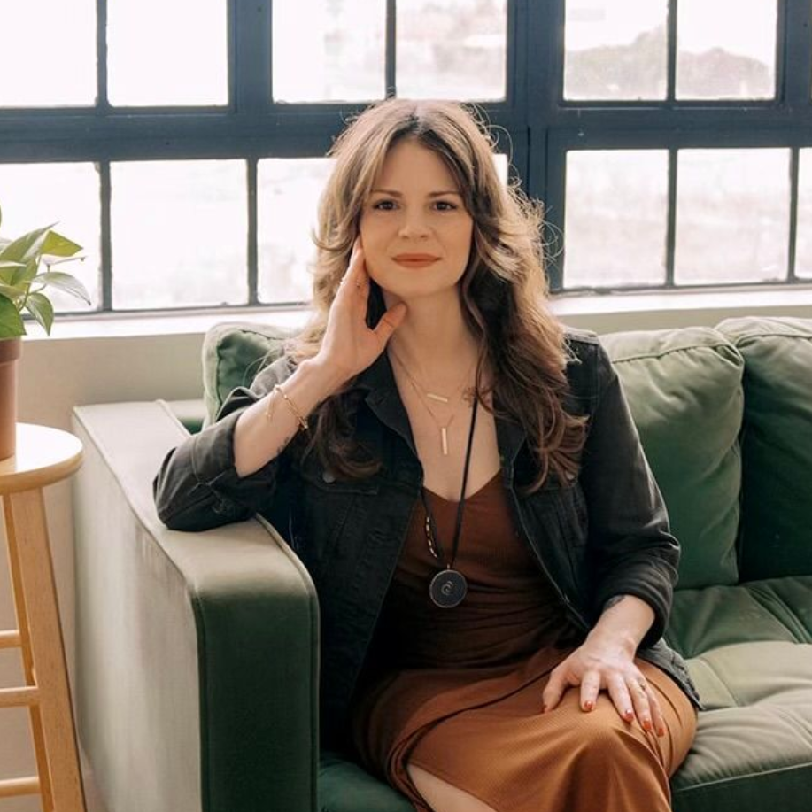 Jennifer Lancaster sitting on a couch.