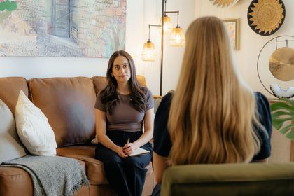 Therapist talking to her client who is burnt out.