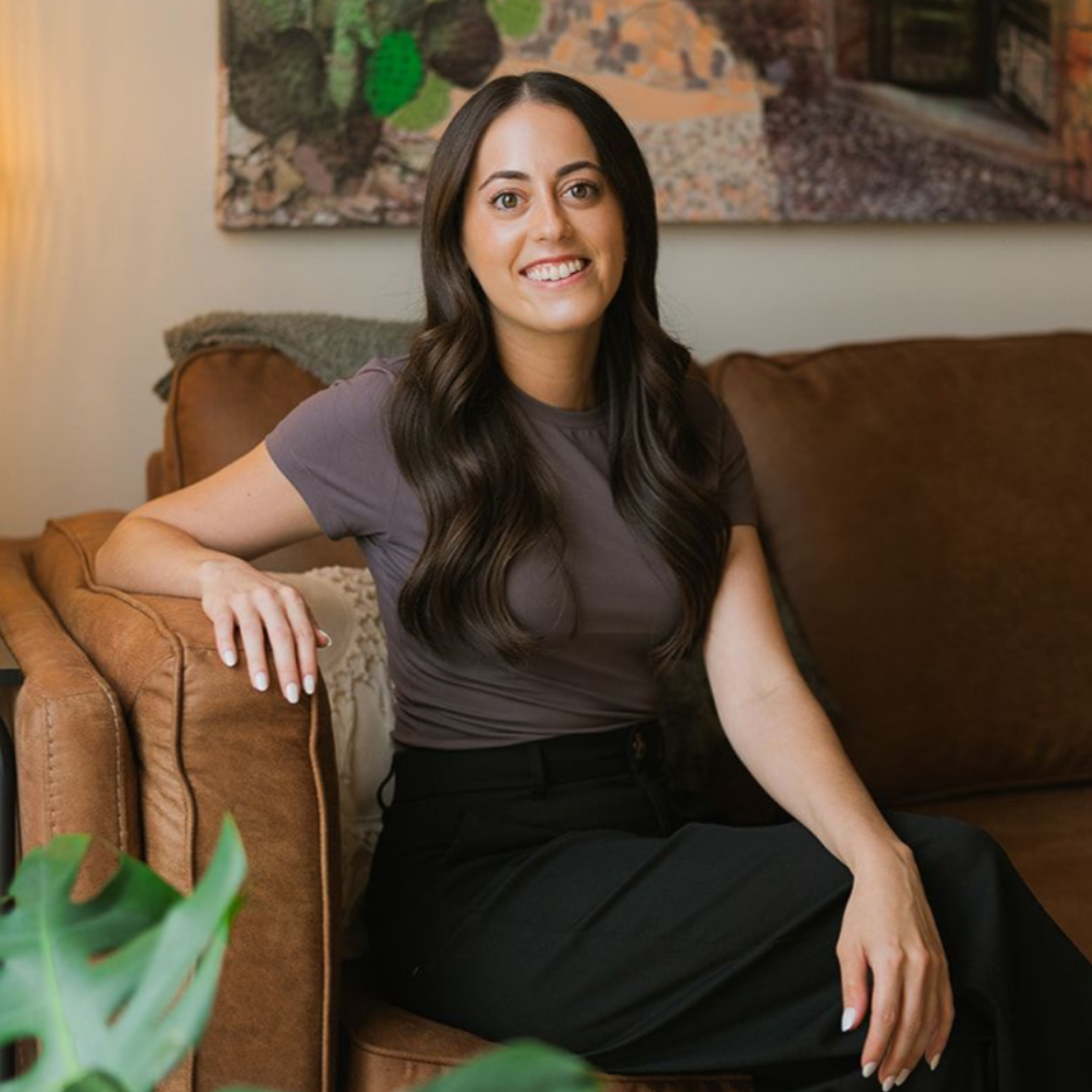 Jamie Weiser sitting on a couch.