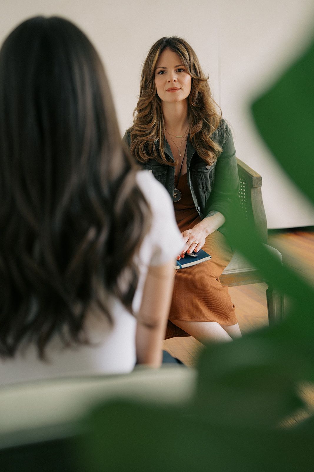 Trauma therapist listening to a client during a betrayal trauma therapy session in Houston, Texas