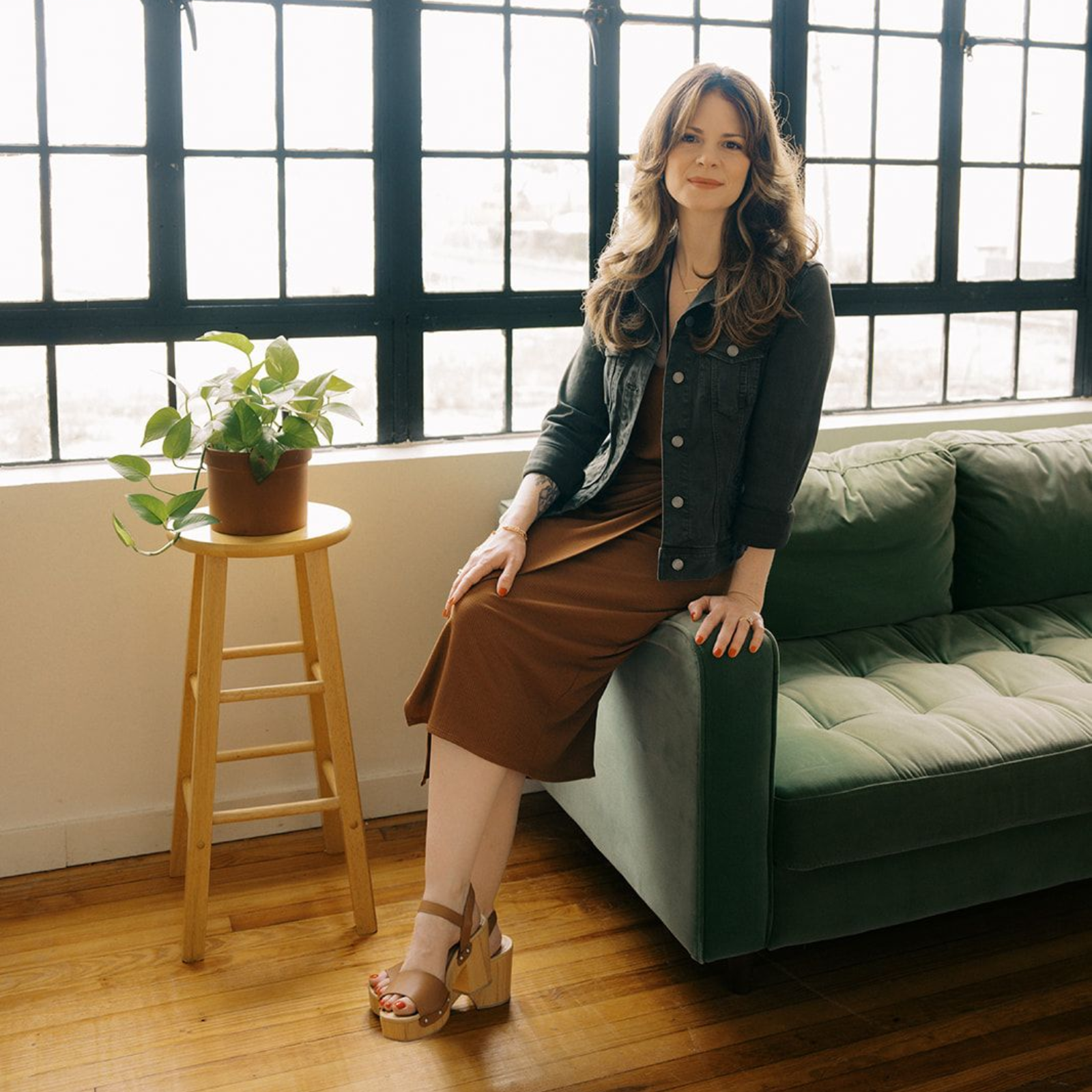 Jennifer Lancaster sitting on a couch.