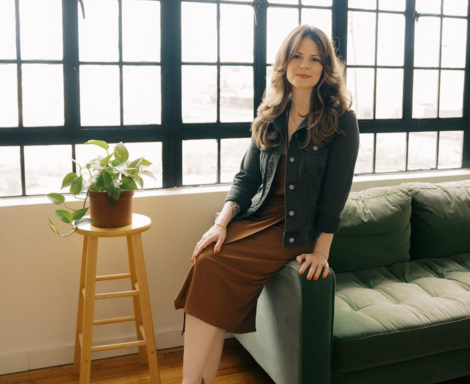 Jennifer Lancaster sitting on a couch.
