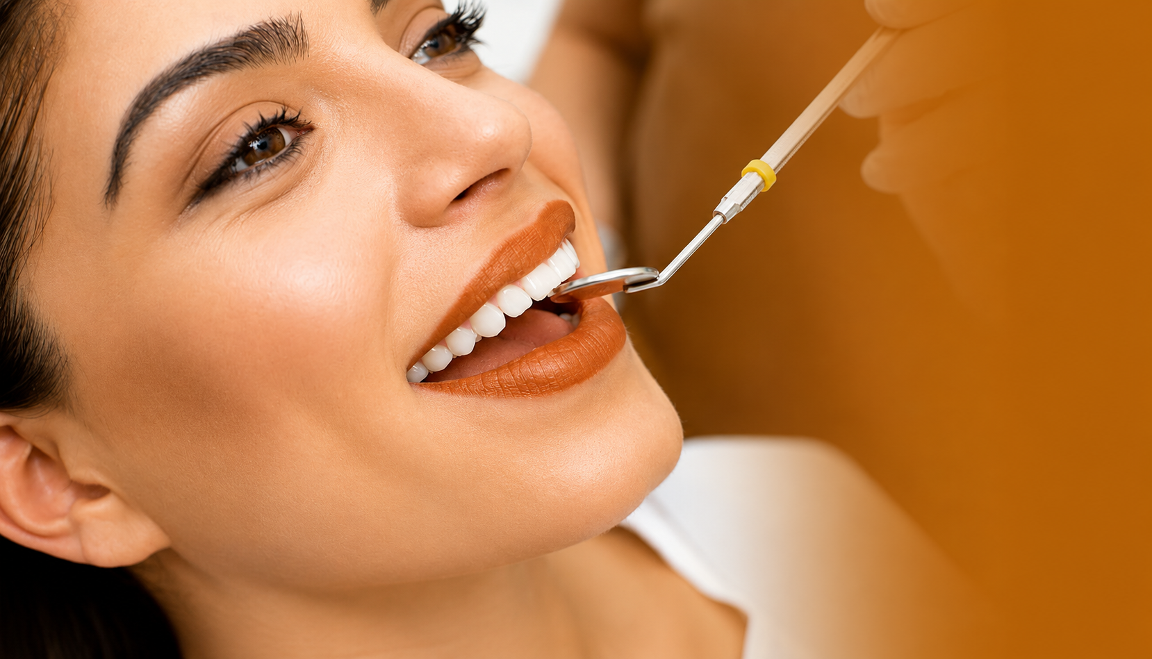 Woman smiling at dentist, having teeth examined.