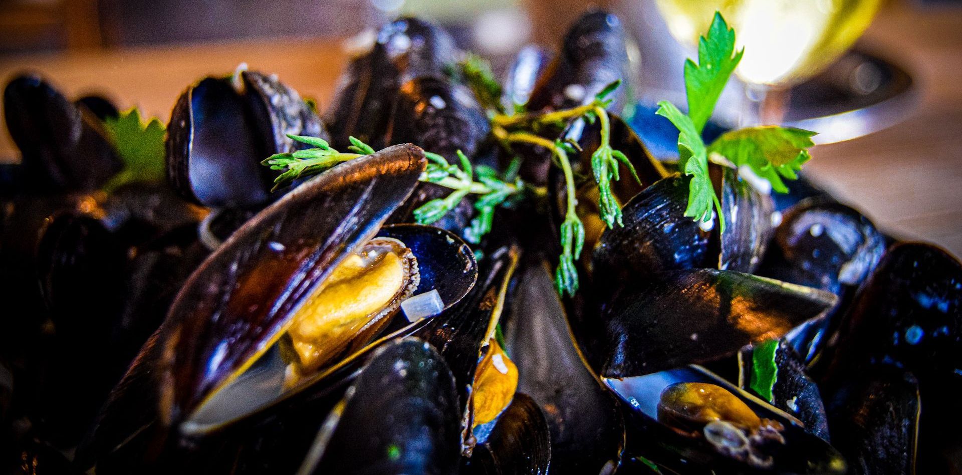 Exmouth mussels with fresh herbs and white wine.