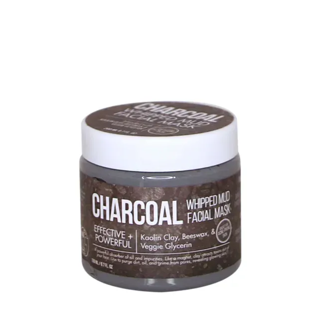 a jar of charcoal whipped mud facial mask on a white background .