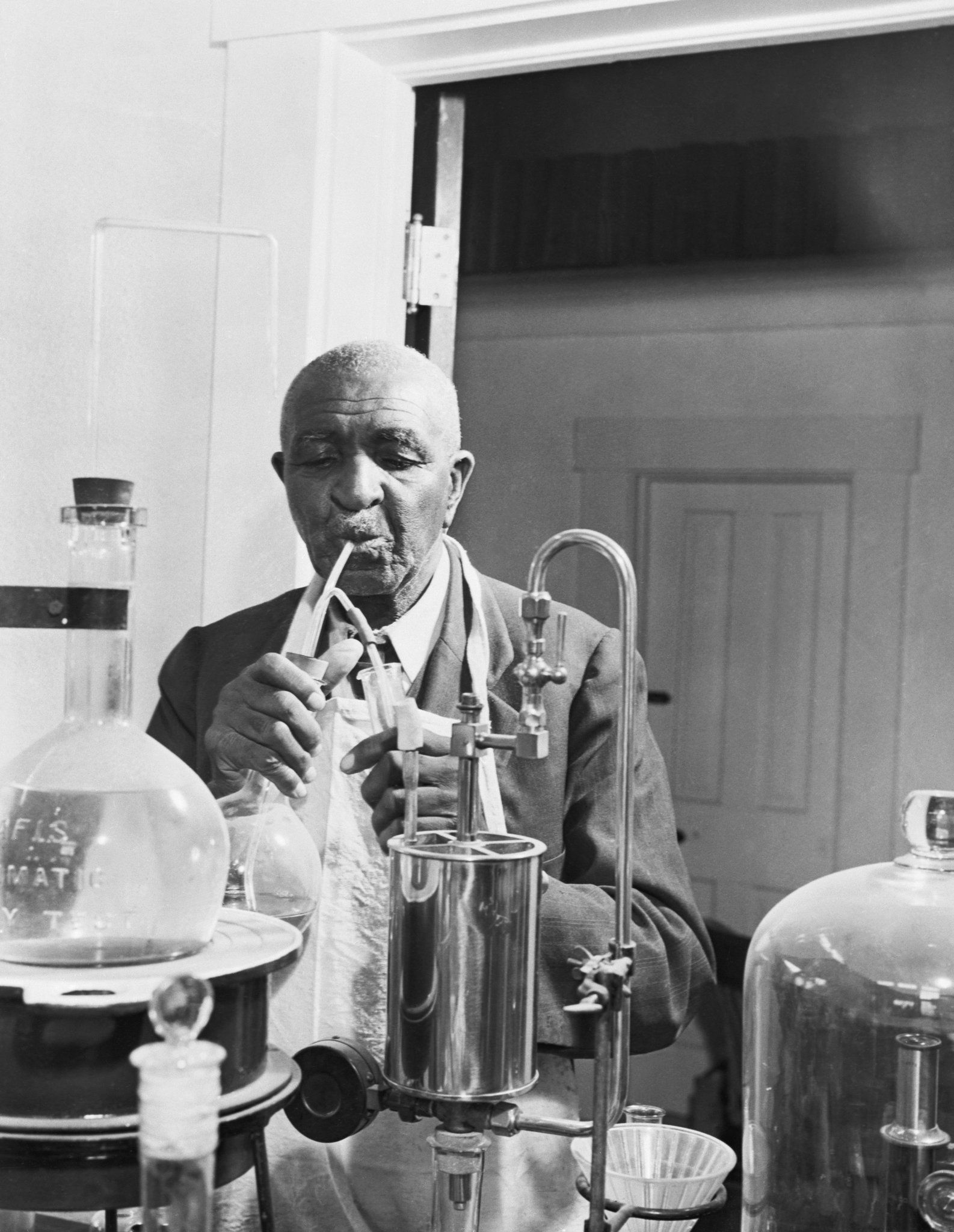 The American scientist and inventor George Washington Carver in his lab at Tuskegee Normal and Industrial Institute in 1925.