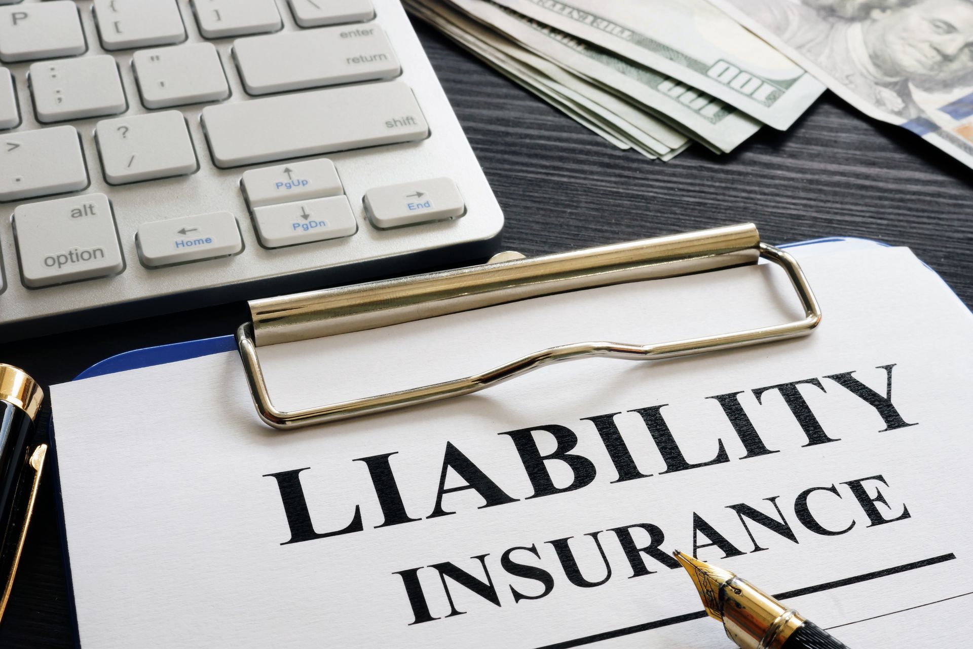 A clipboard with liability insurance written on it