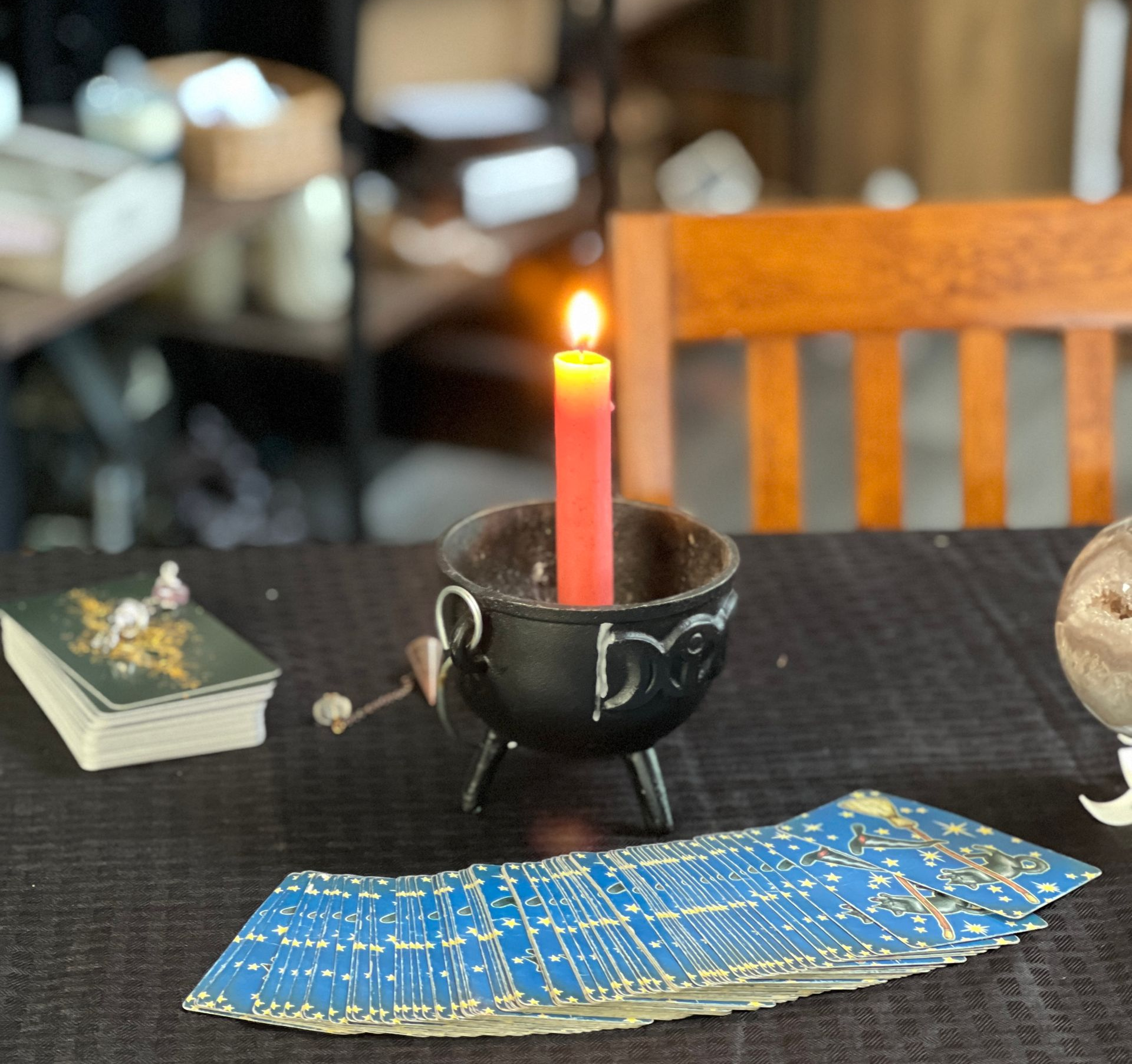 A person is holding a tarot card in their hands.