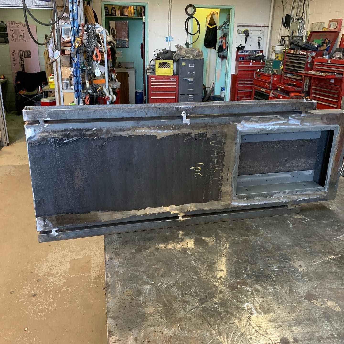 A piece of metal is sitting on a table in a workshop
