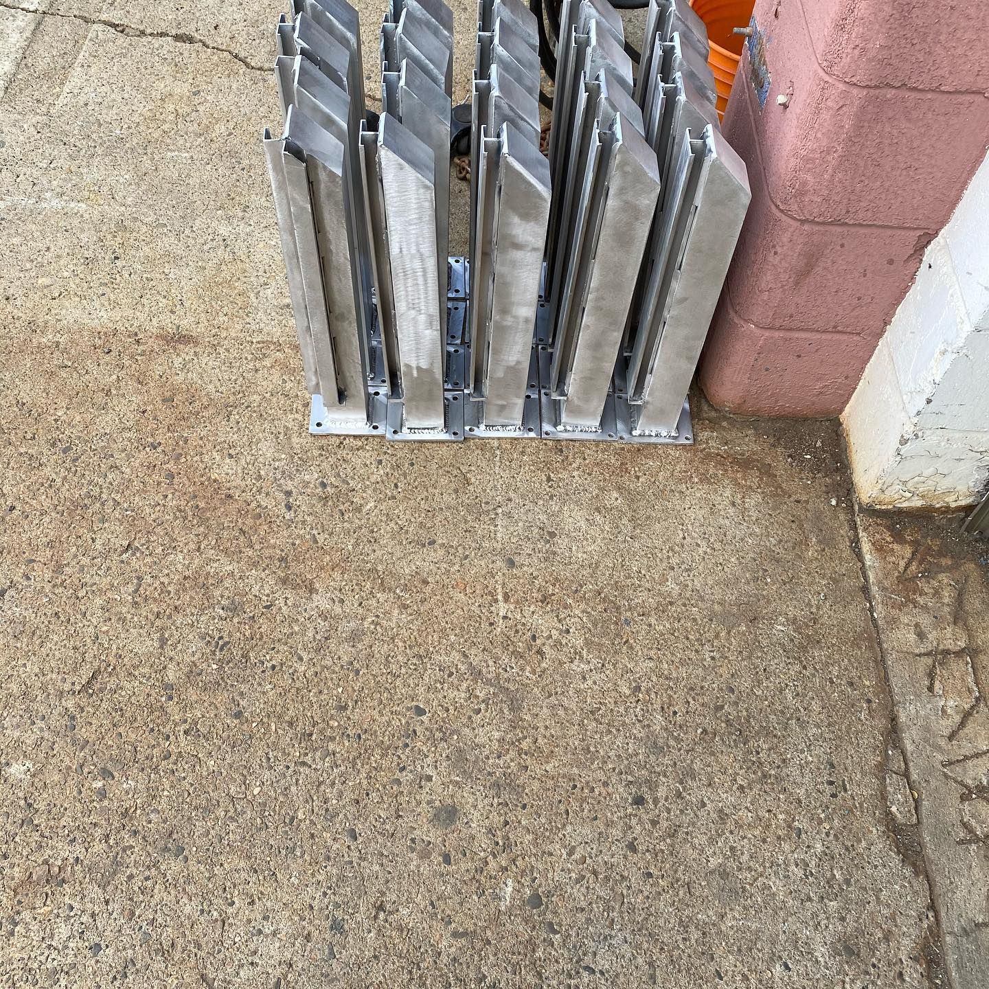 A bunch of metal pieces are sitting on the ground