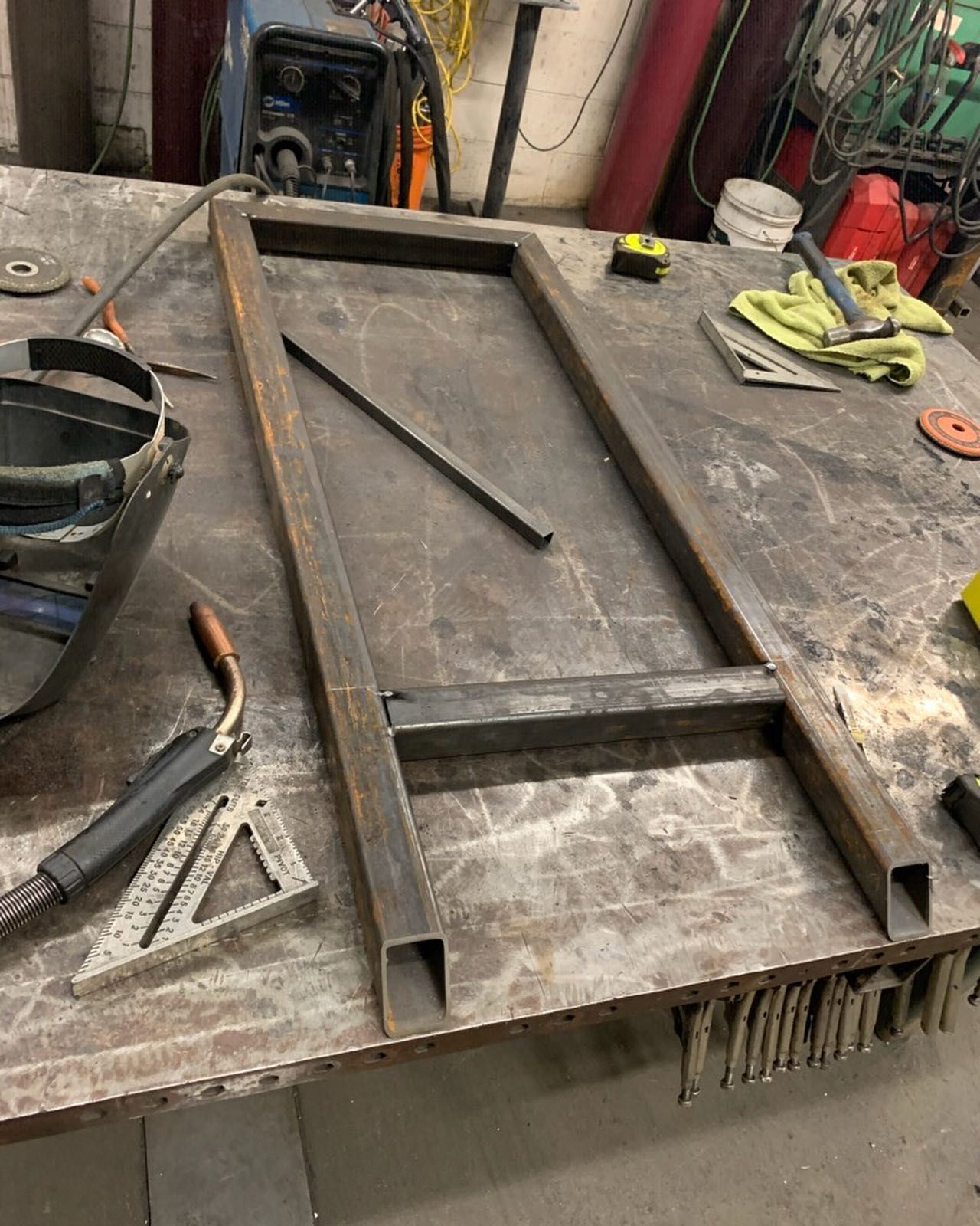 A welding table with a piece of metal on it.