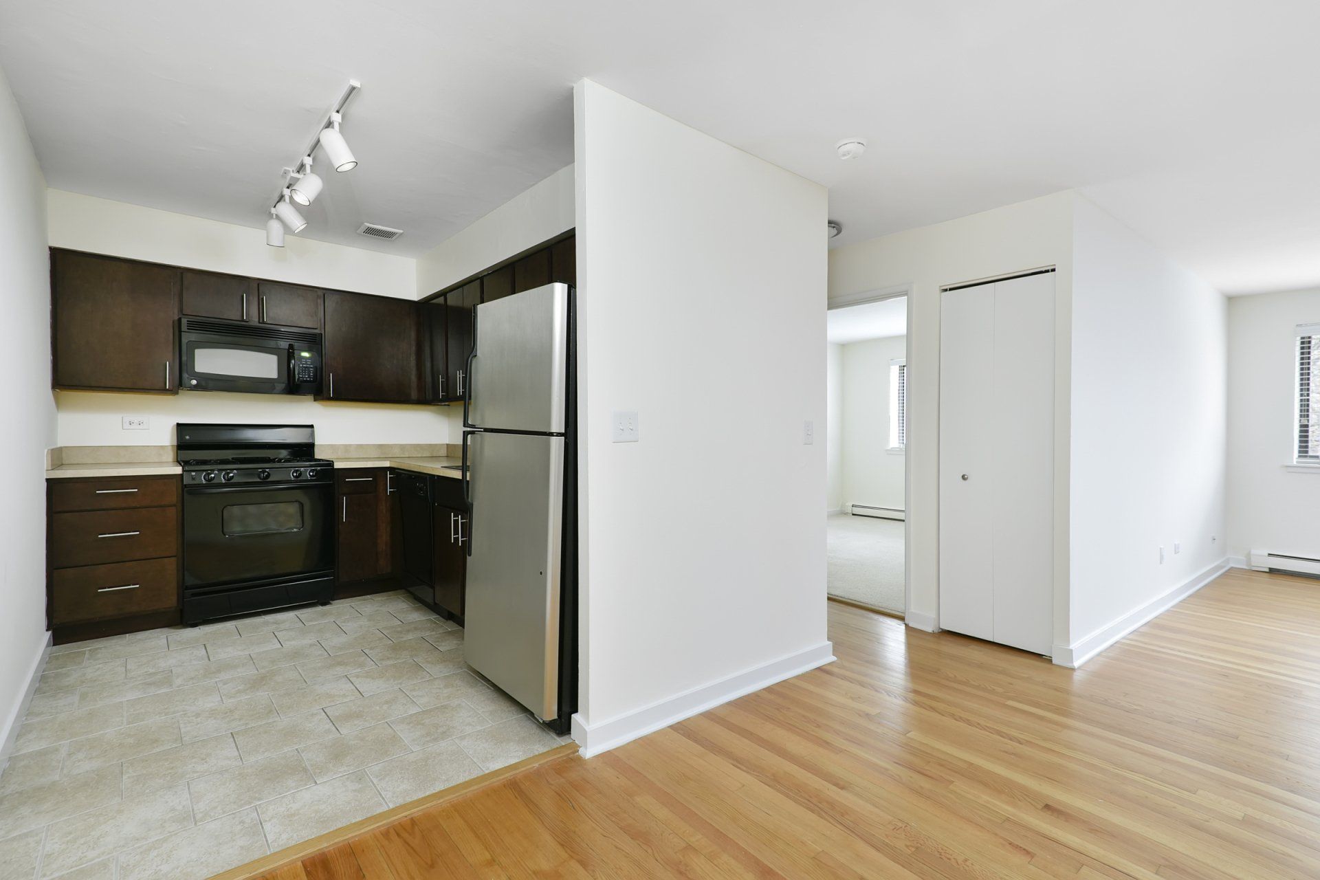 Empty apartment floor plan with kitchen view at Reside on Stratford.
