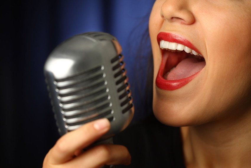 woman singing with red lipstick