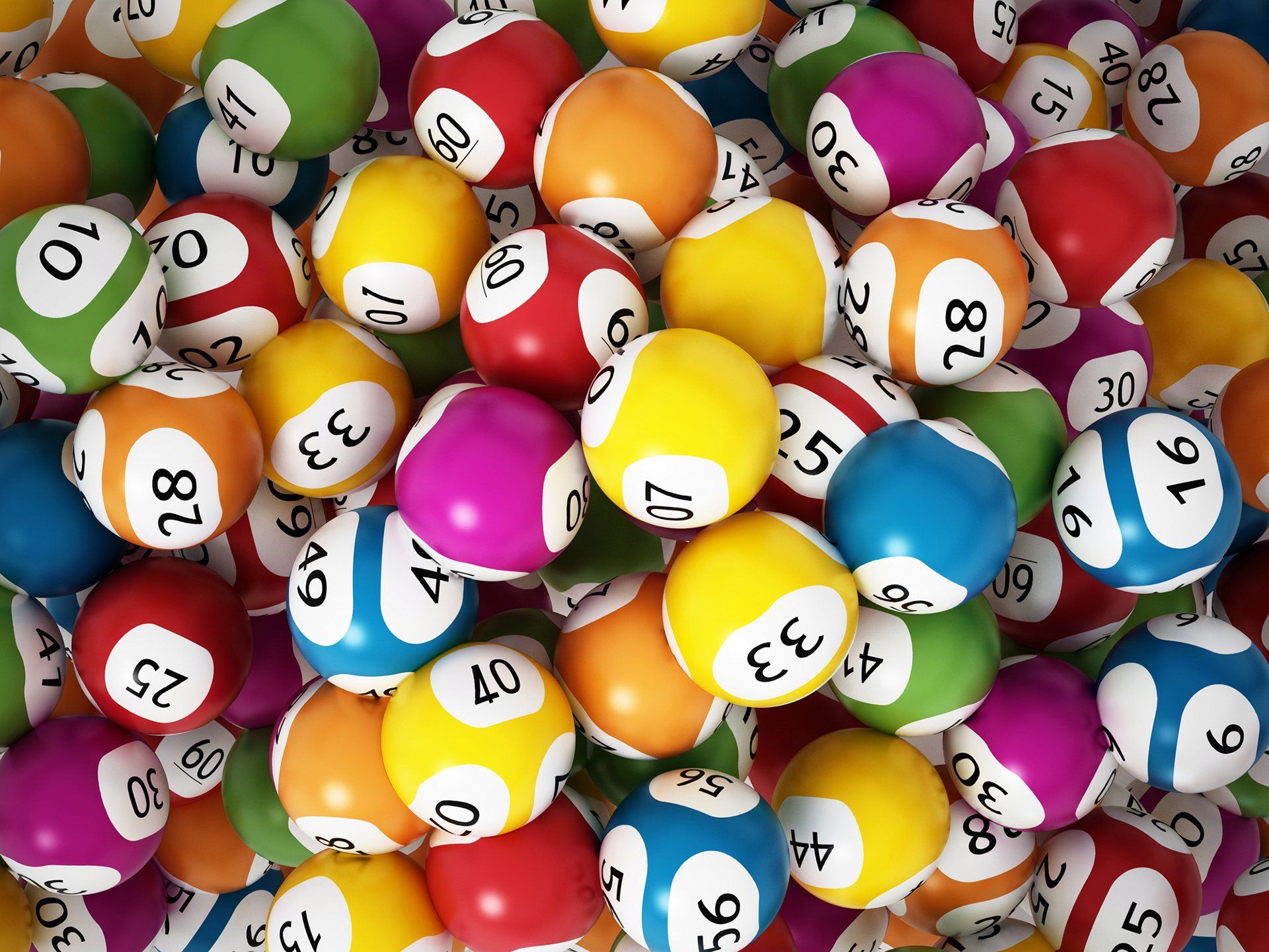 a pile of colorful pool balls with numbers on them