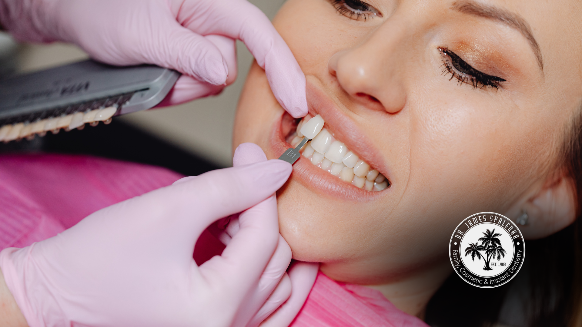 A woman is getting her teeth whitened by a dentist.