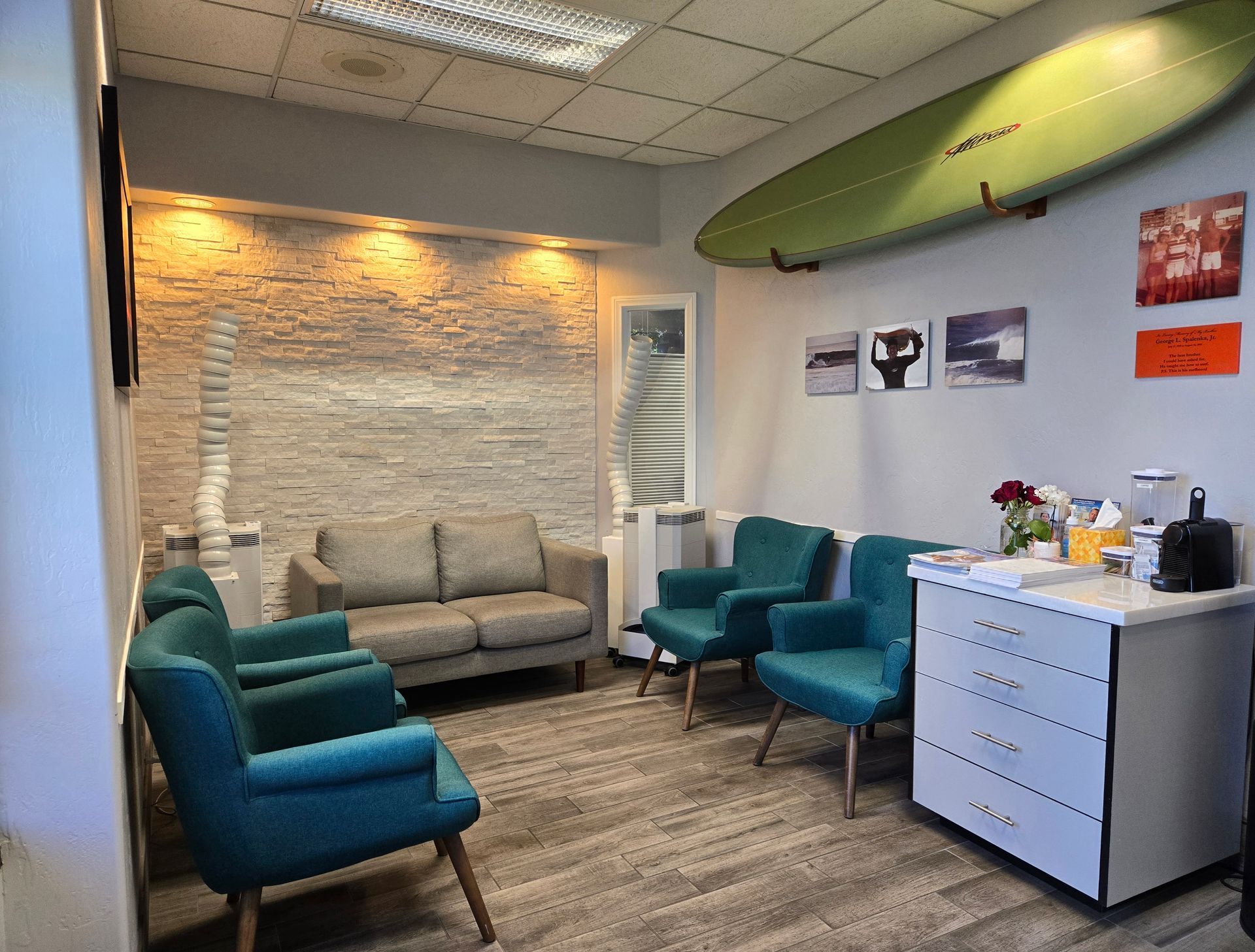 A man and a woman are sitting at a counter in a dental office.