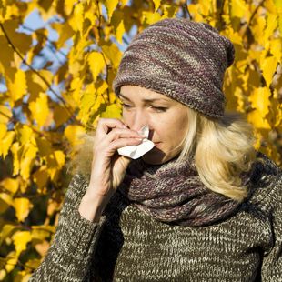 Woman clearing nose