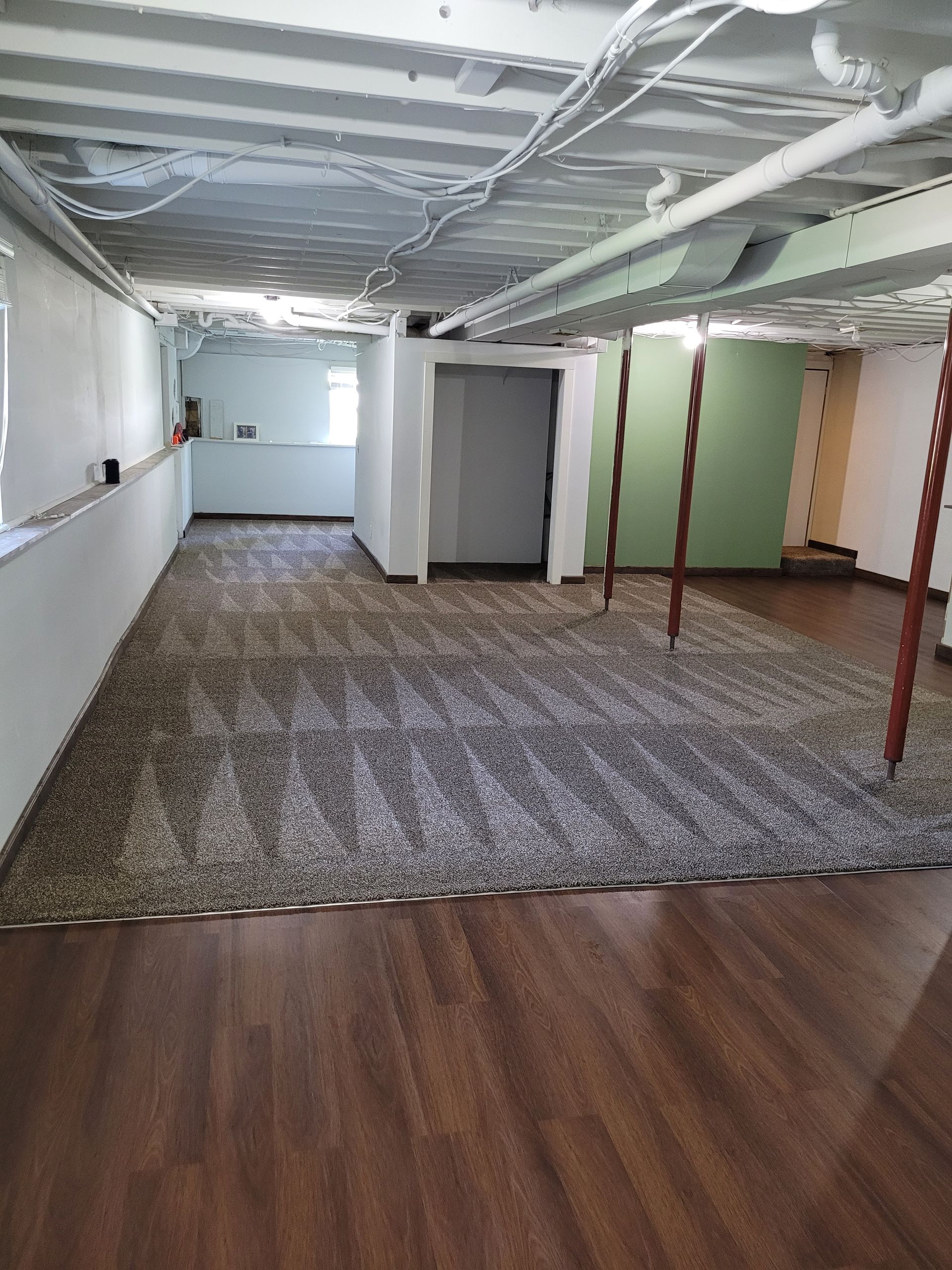 A Man Spraying a Kitchen Counter with A Sprayer | Watervliet, MI | Mr. Cleans Restoration