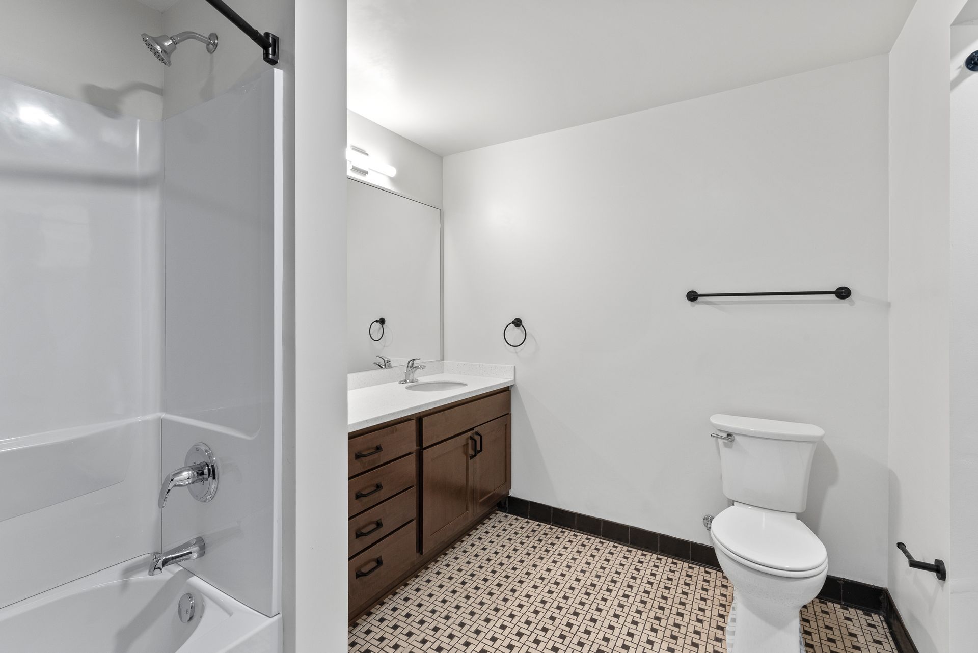 Photo showing a bathroom with plenty of walking space and a shower/tub combo