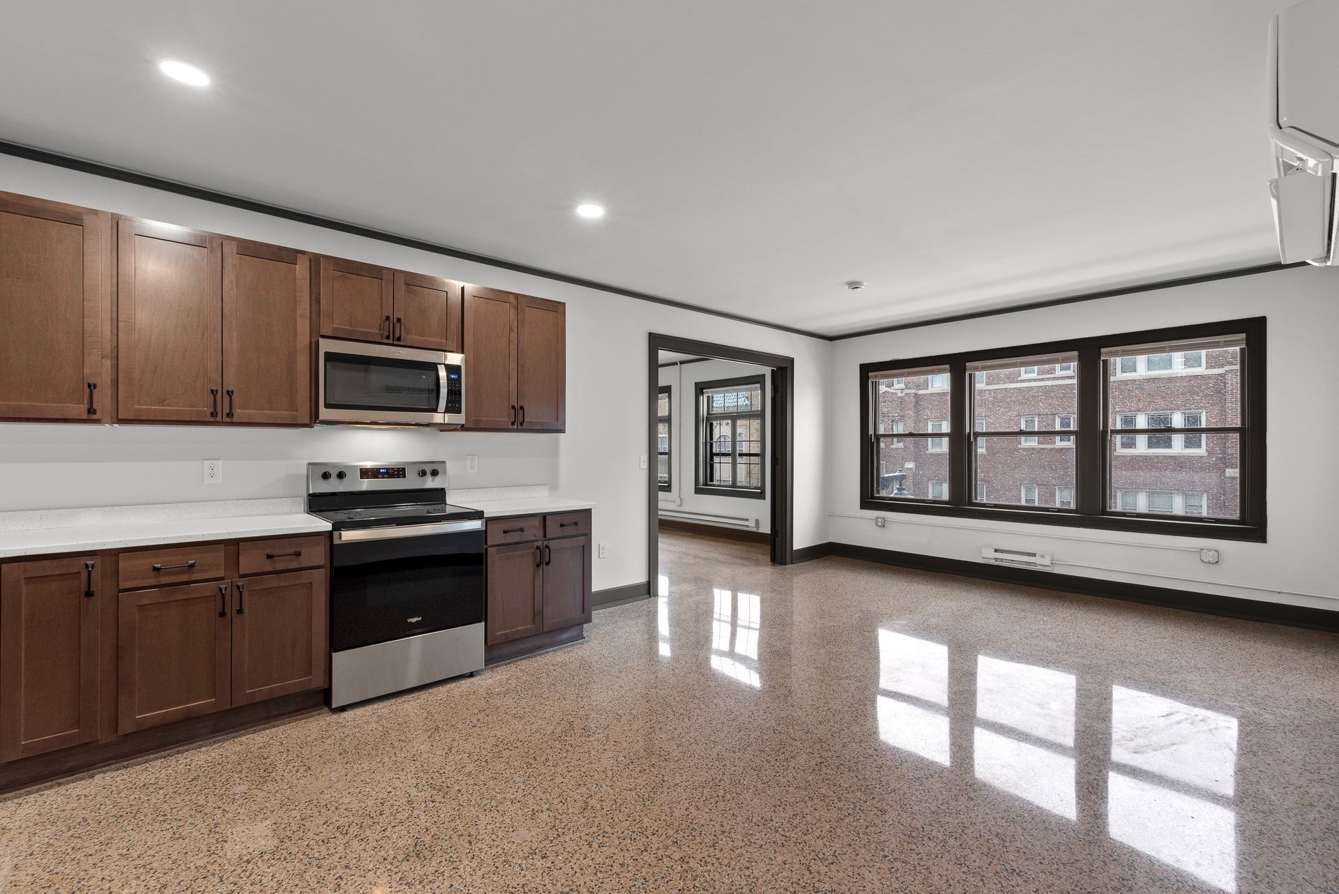 Photo showing the kitchen area and living room area