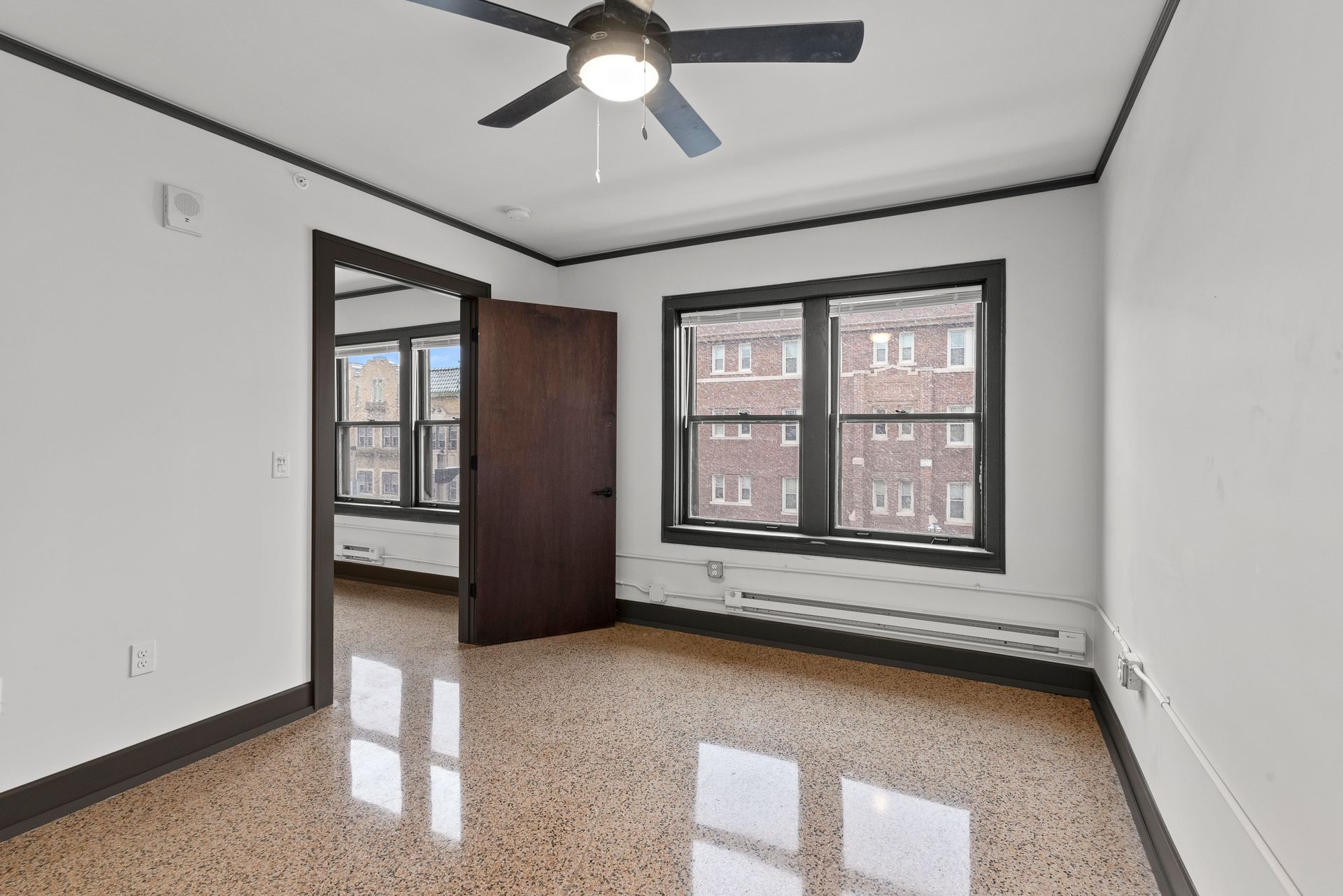 Photo showing a room with large windows