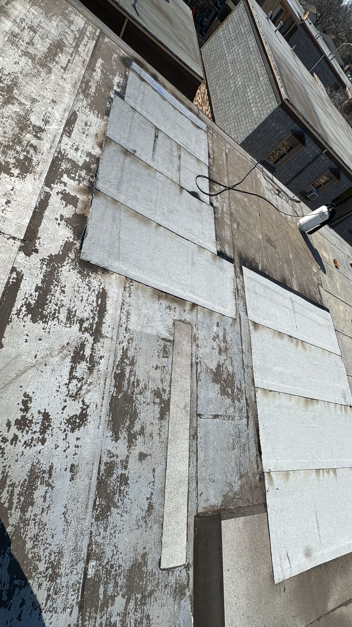 A close up of a concrete wall with a lot of pieces of concrete on it.