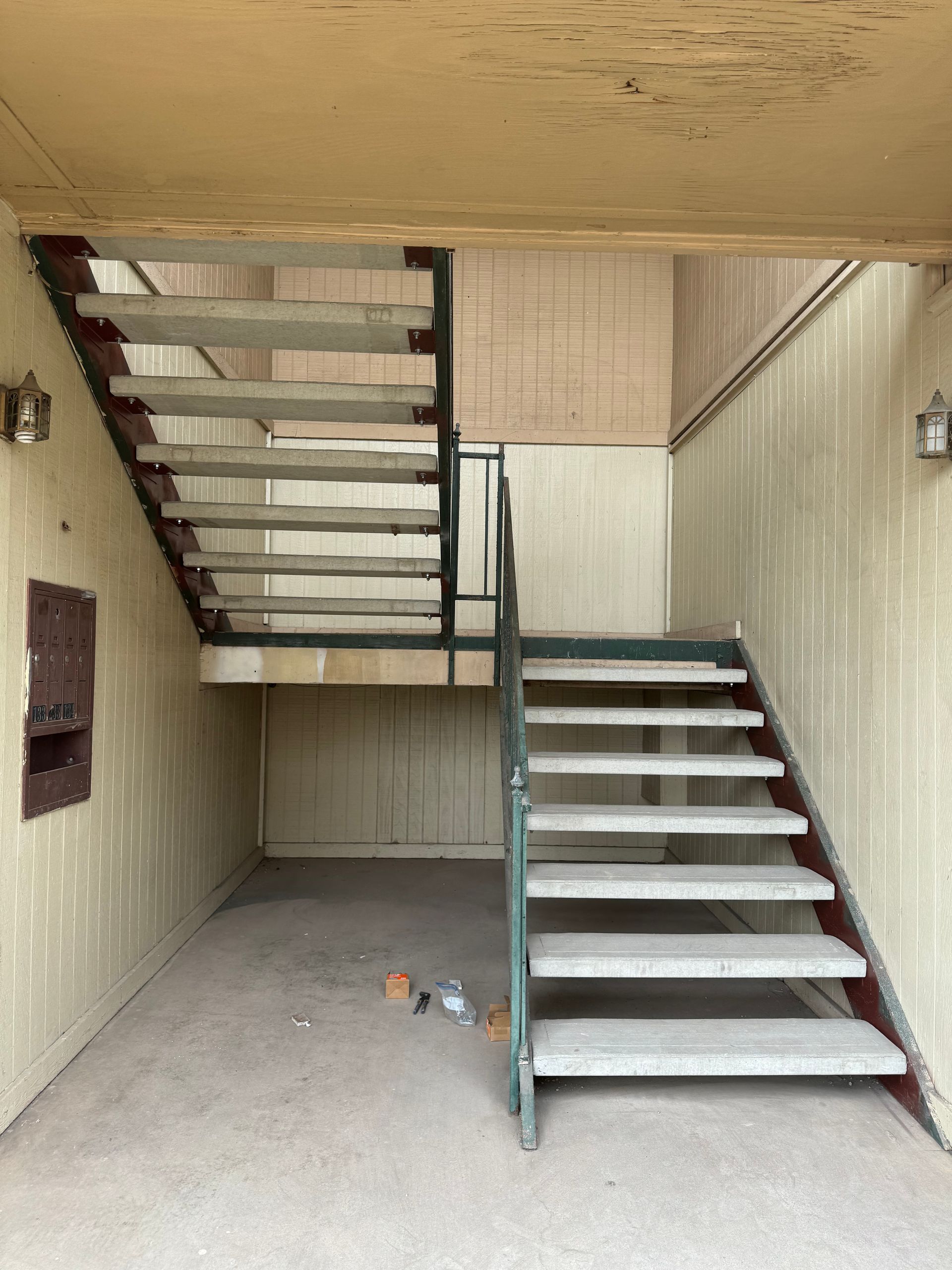 A set of stairs leading up to the second floor of a building.