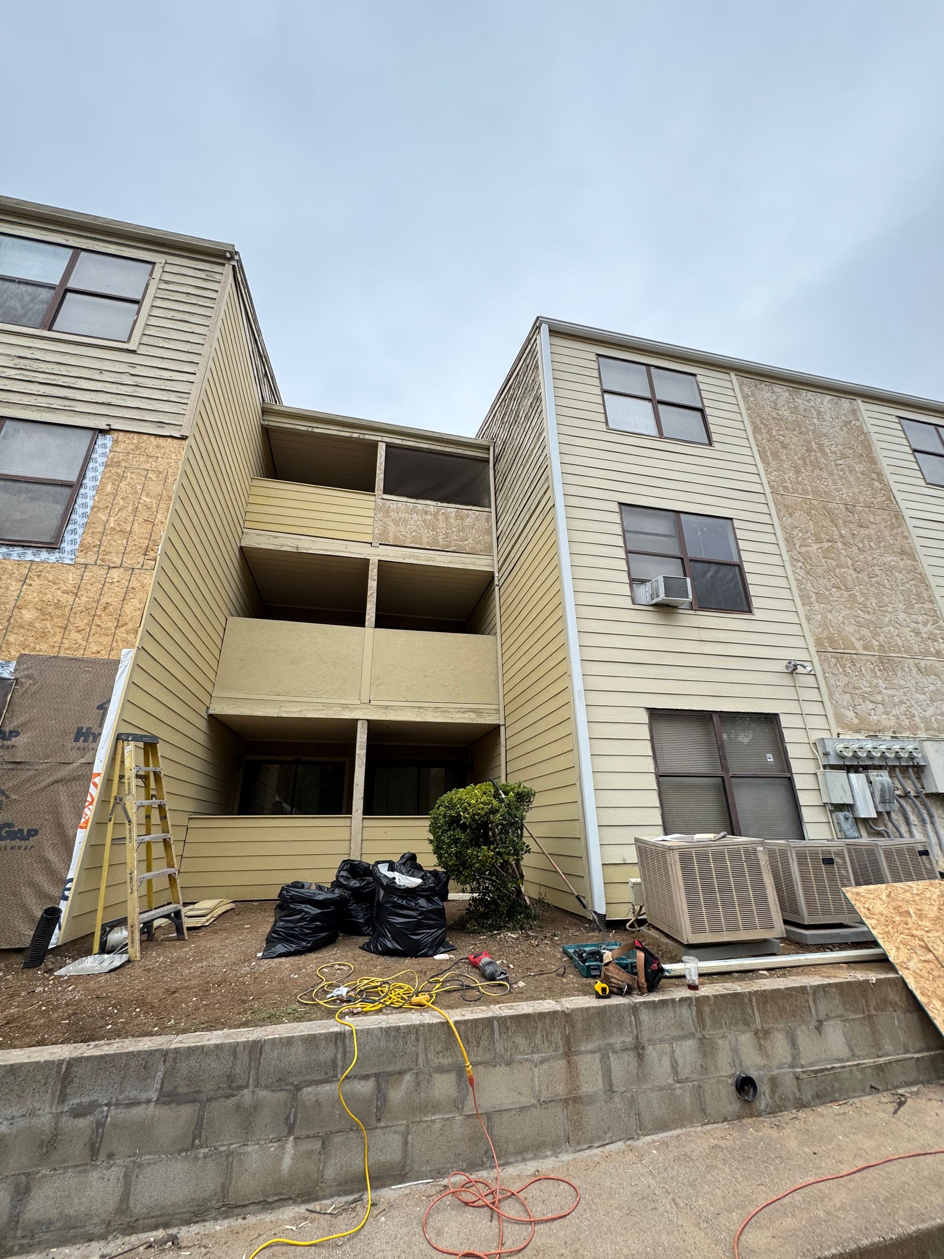 A building with a lot of windows is being remodeled.