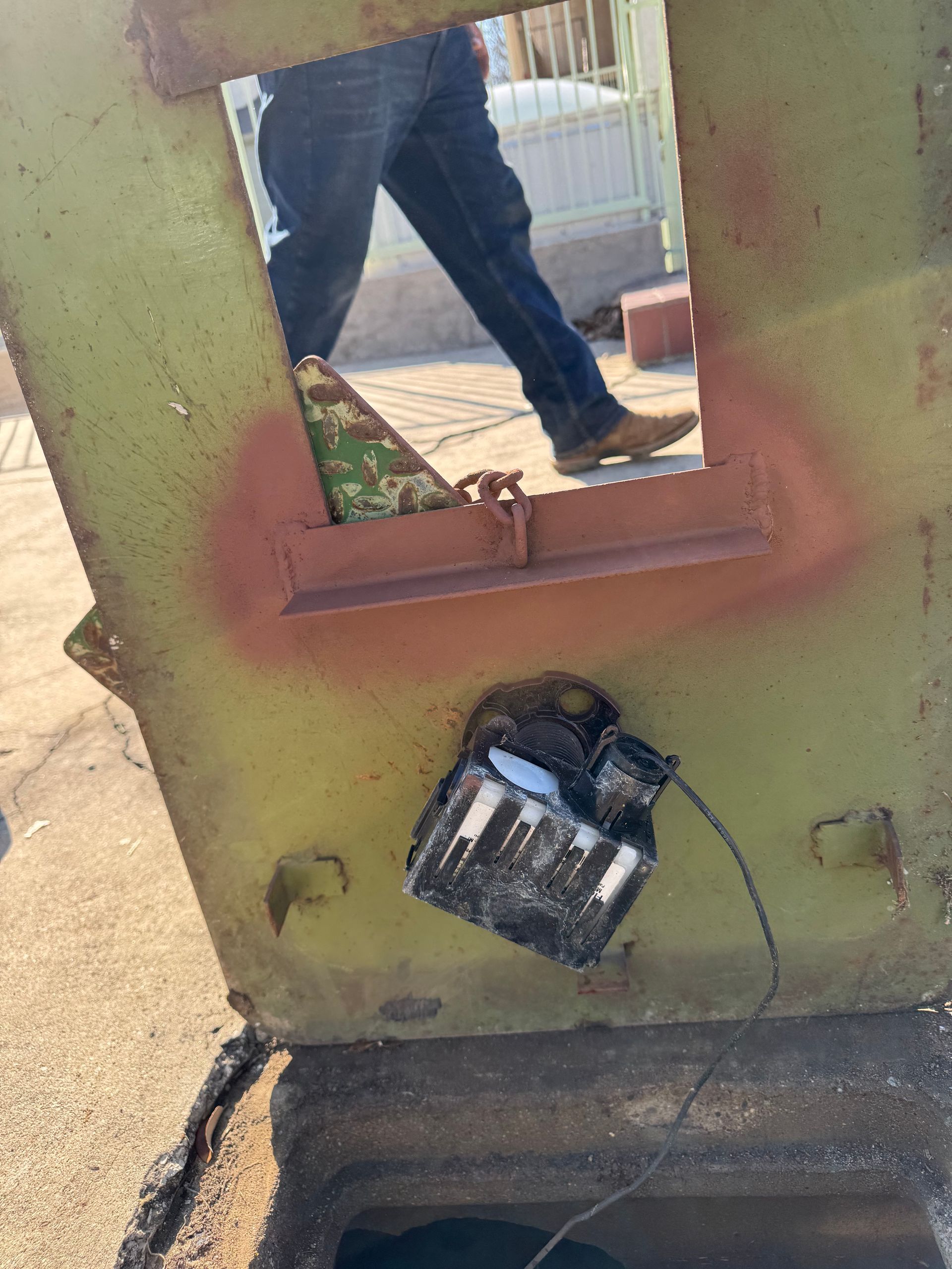 A person is walking through a hole in a wall.