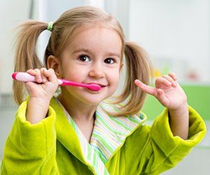 Family Dental Practice — Kid Brushing its Teeth in Wilmington, NC