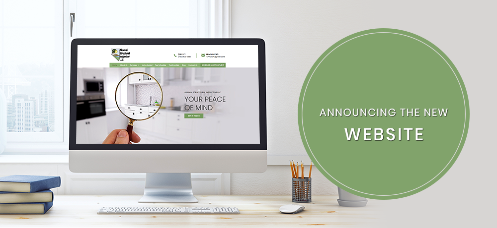 An office desk with a computer displaying a website, and a green circle announcing the new website.