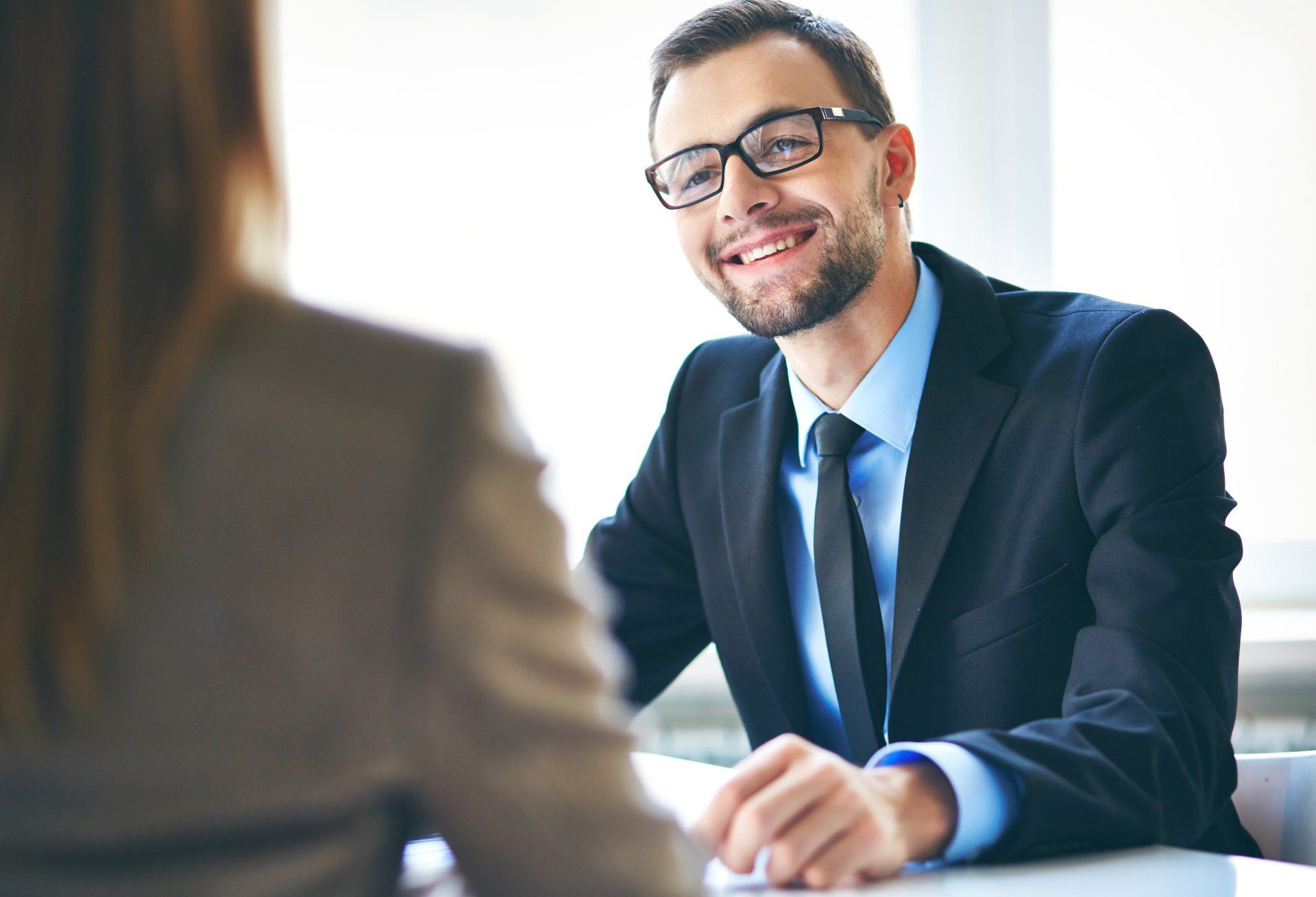 A young businessman interviewing female