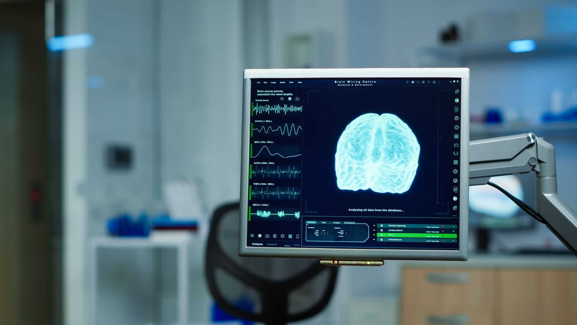 Monitor displaying a brain scan in a medical lab setting.