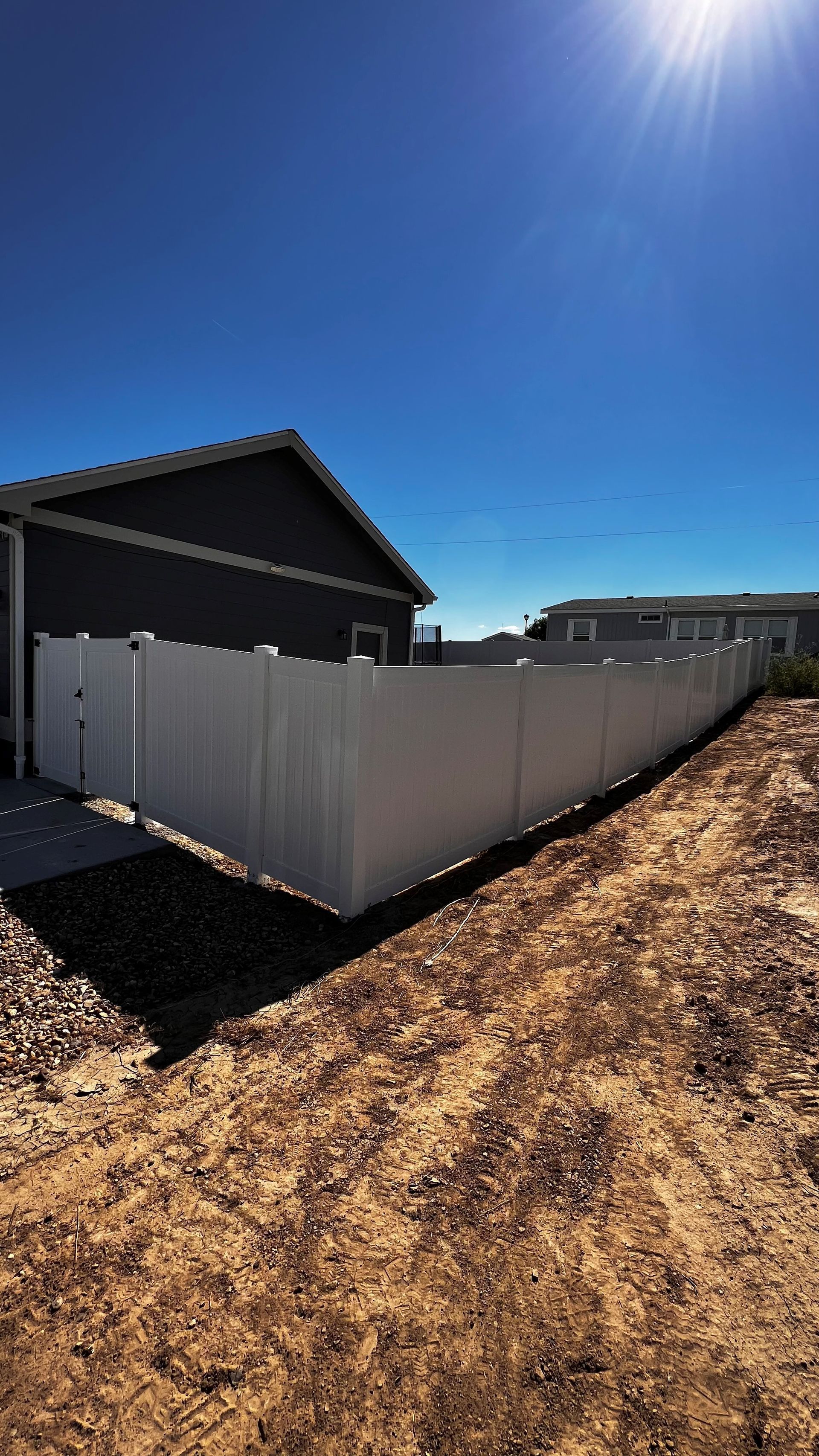 White viynl privacy fence — Greeley, CO — Fence Pros