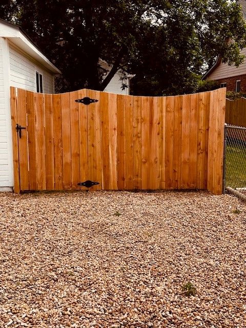 High cedar fence with design — Greeley, CO — Fence Pros