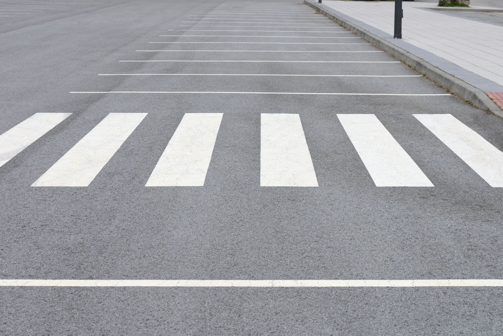 Crosswalk With White Stripes on Asphalt, Leading to a Sidewalk — ALI Civil Pty Ltd in South Nowra, NSW